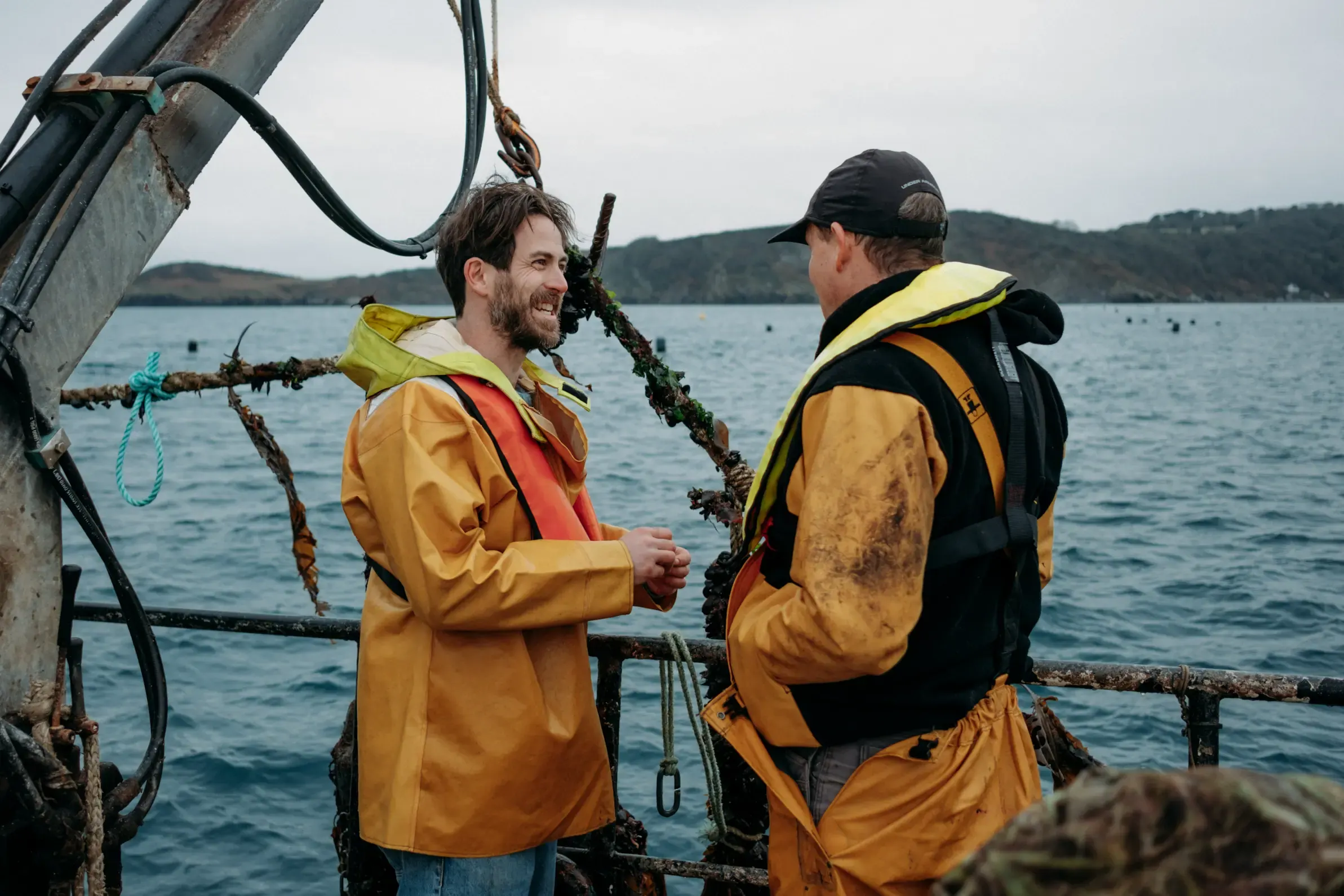 James Strawbridge and Gary from Westcountry Mussels of Fowey on the mussel fishing boat in St Austell Bay, Cornwall