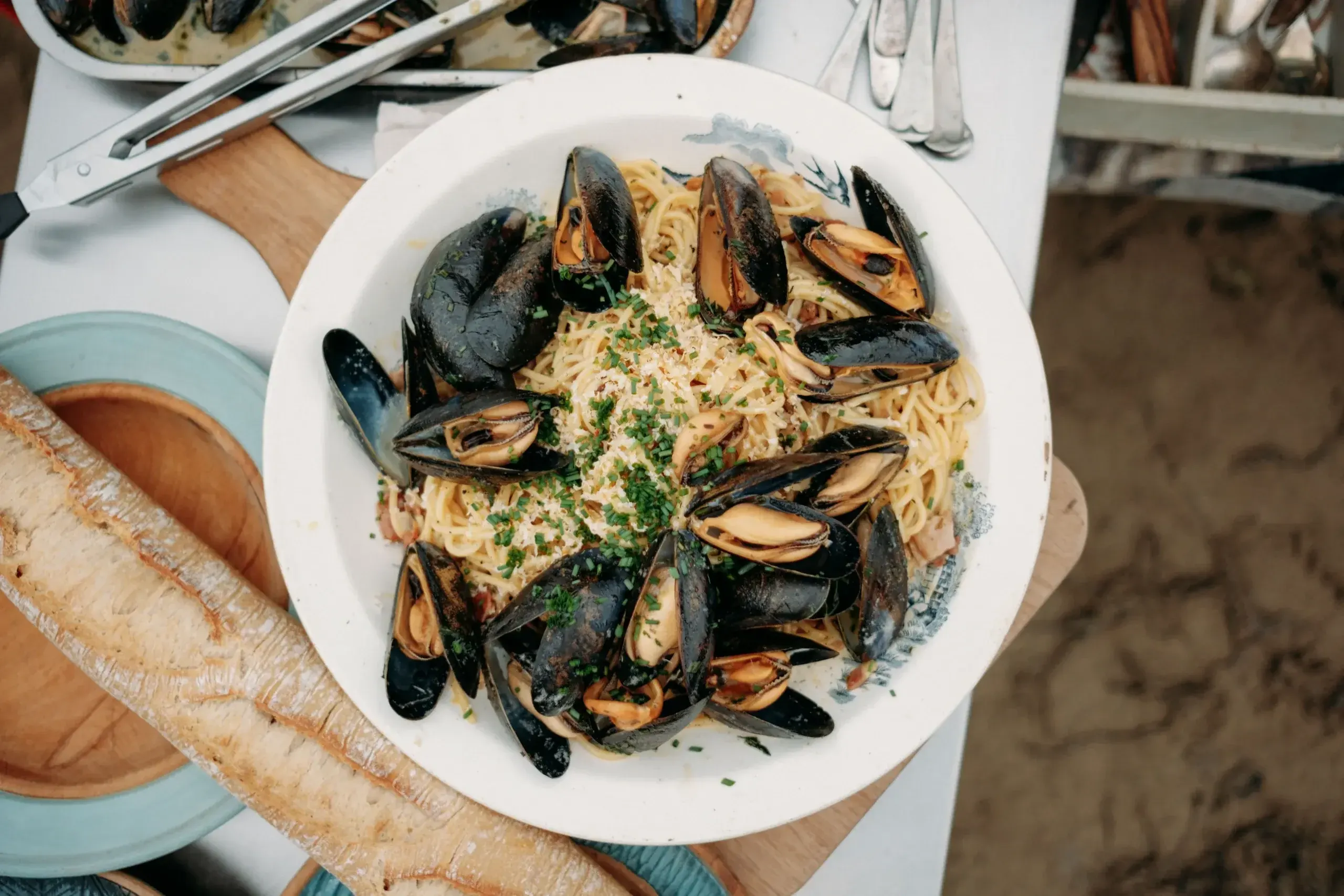 James Strawbridge's smoked Cornish mussel carbonara with fresh chives and grated cheese, served on Readymoney Beach, Fowey