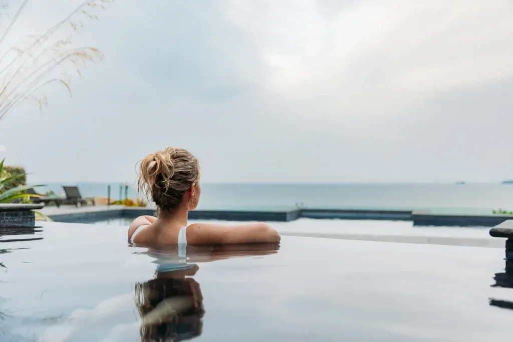The infinity pool overlooking the sea at C Bay Spa
