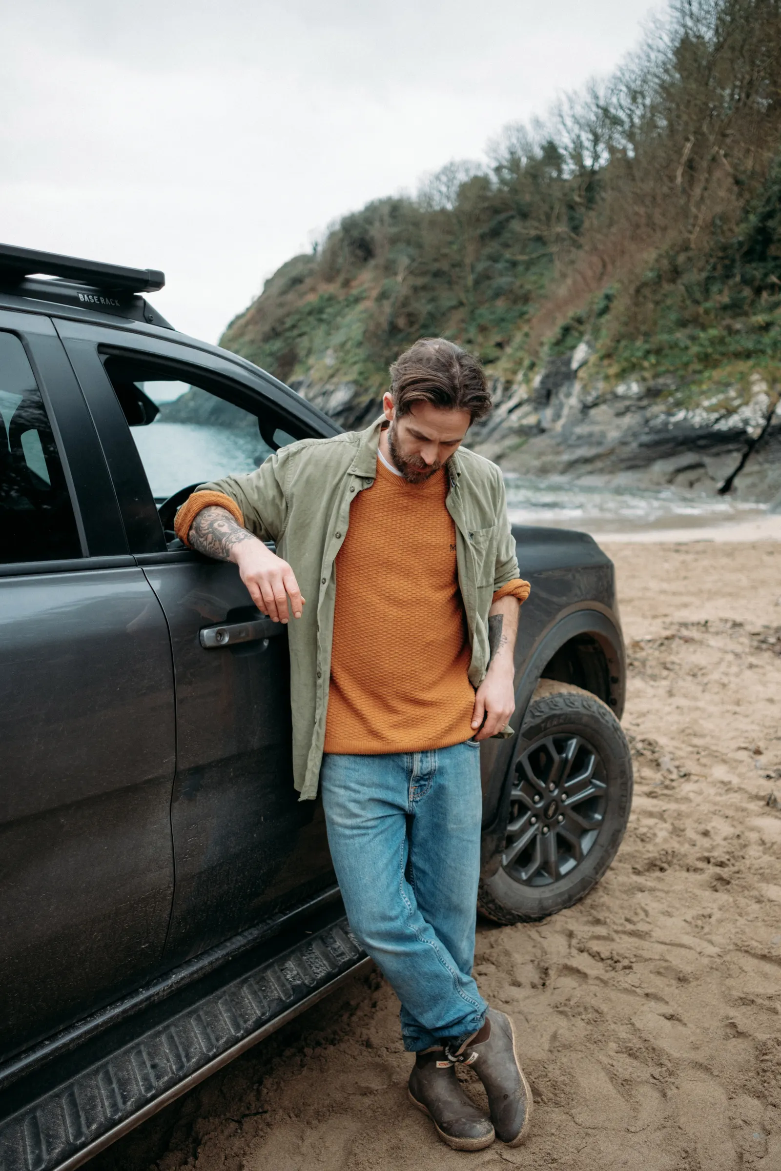 James Strawbridge beside a Ford Ranger during a coastal photography shoot