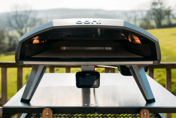 Ooni Koda 2 Pro pizza oven on a modular table with Cornwall countryside in the background